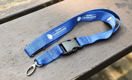 A blue lanyard with the Quinte Conservation logo 